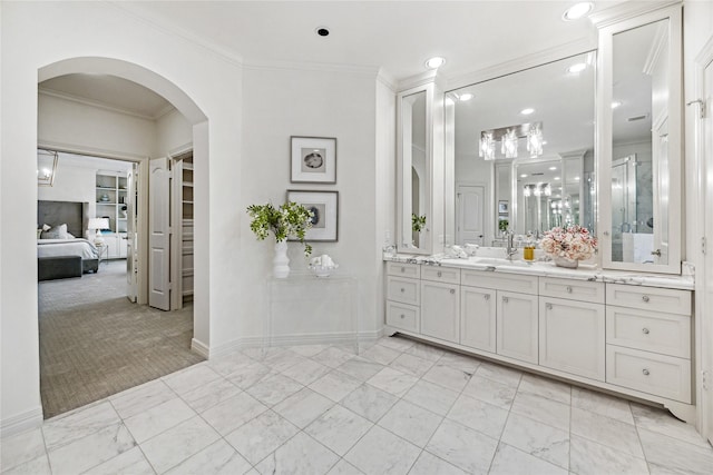 bathroom featuring vanity and ornamental molding