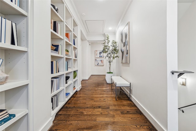 corridor featuring ornamental molding and dark hardwood / wood-style flooring