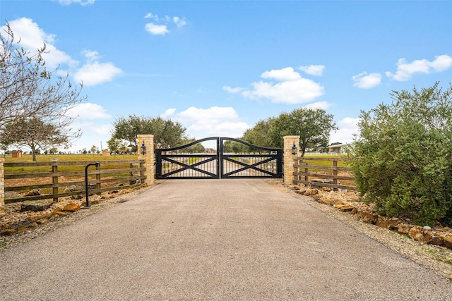 view of gate featuring a rural view