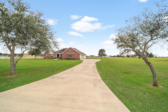 view of property's community with a yard