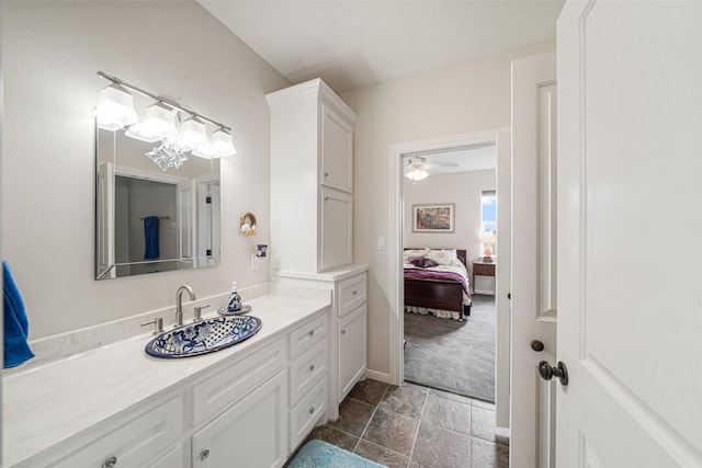 bathroom with ceiling fan and vanity