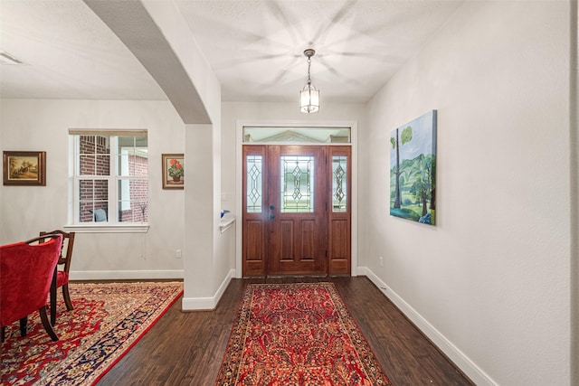 entryway featuring dark wood-type flooring