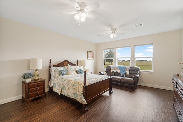 bedroom with ceiling fan and dark wood-type flooring