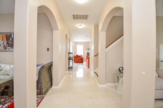 corridor with light tile patterned floors