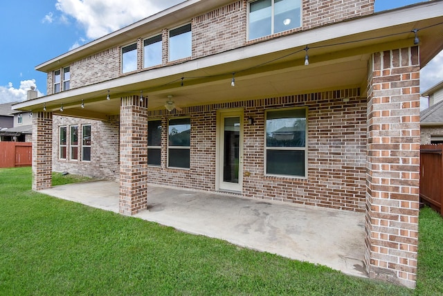 exterior space with a lawn, ceiling fan, and a patio