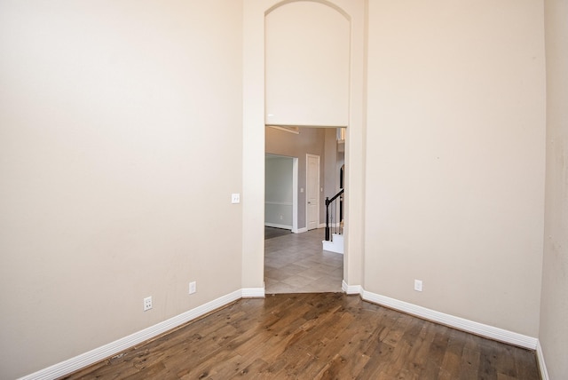 spare room featuring dark wood-type flooring