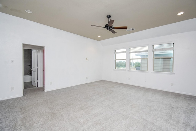 carpeted empty room with ceiling fan and lofted ceiling