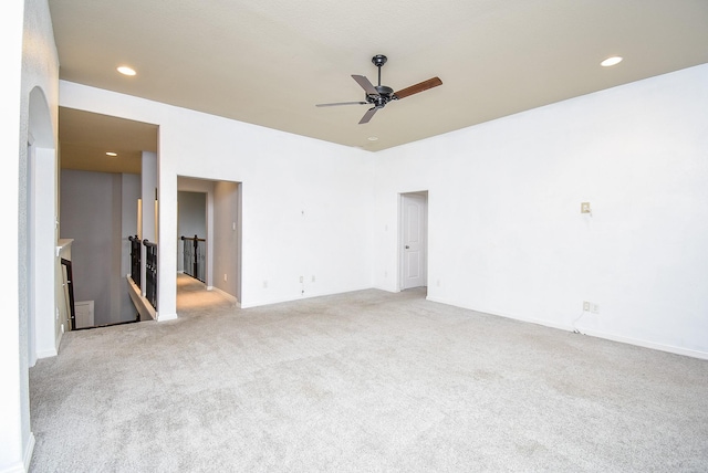 carpeted empty room with ceiling fan