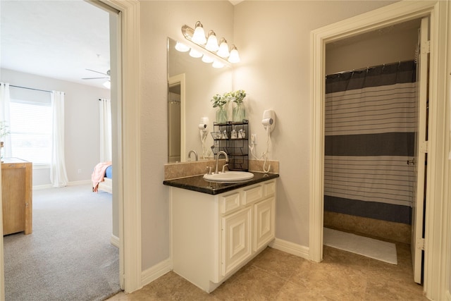 bathroom with vanity and ceiling fan