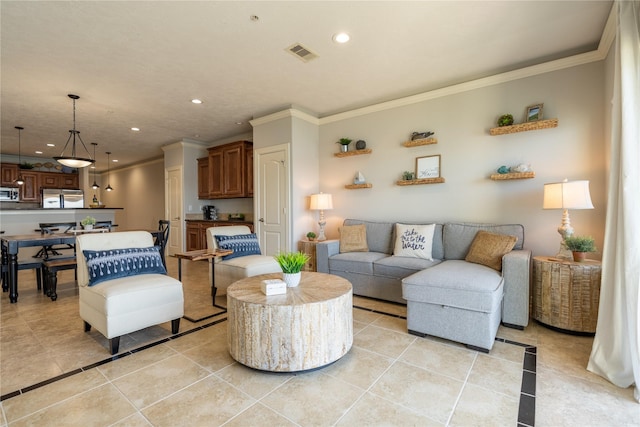 living room with light tile patterned floors and crown molding