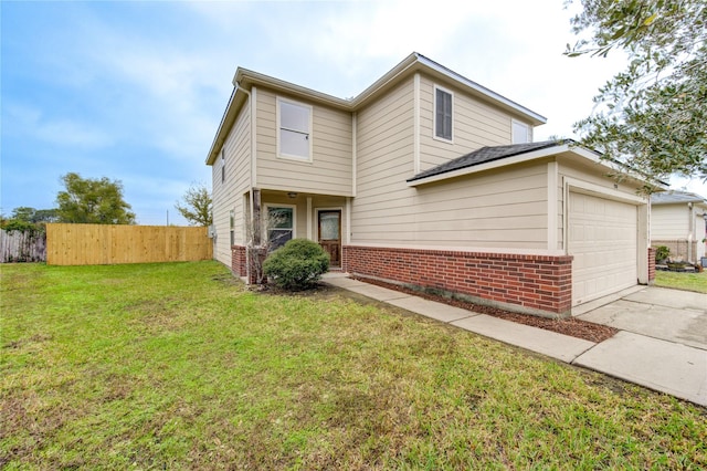 view of front of house with a front lawn and a garage