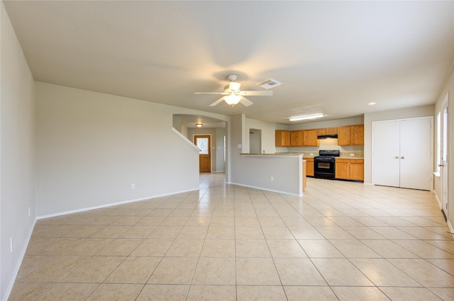 unfurnished living room featuring ceiling fan and light tile patterned flooring