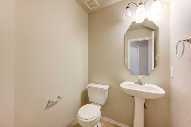 bathroom with toilet and sink