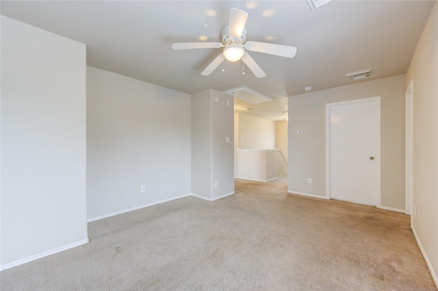 unfurnished room with light carpet and ceiling fan