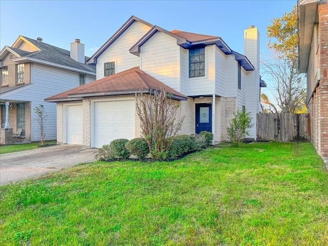 front facade featuring a garage and a front lawn