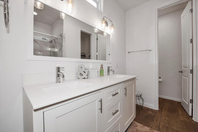 bathroom featuring a shower and vanity