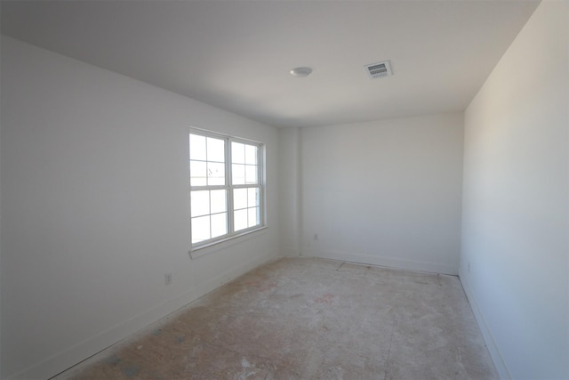 spare room with visible vents and baseboards