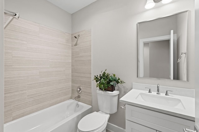 full bathroom with vanity, toilet, and tiled shower / bath combo