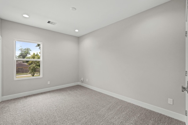 unfurnished room featuring carpet