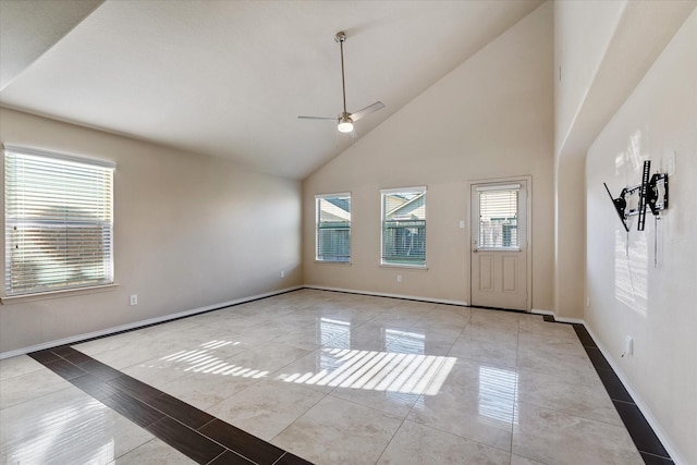 interior space featuring light tile patterned floors, high vaulted ceiling, and ceiling fan