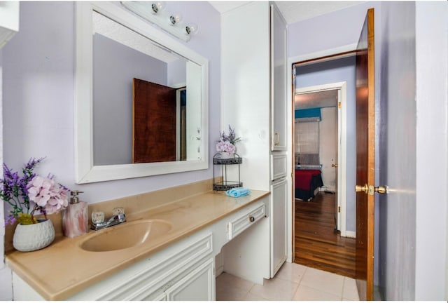 bathroom featuring wood-type flooring and vanity