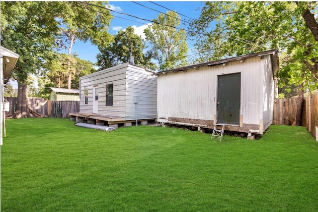 view of outbuilding with a lawn