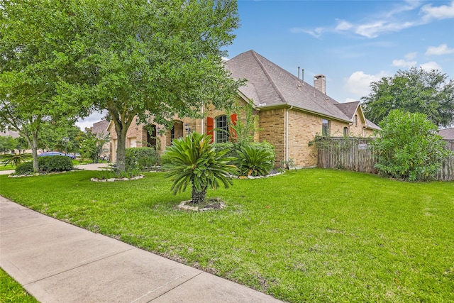 view of home's exterior with a yard