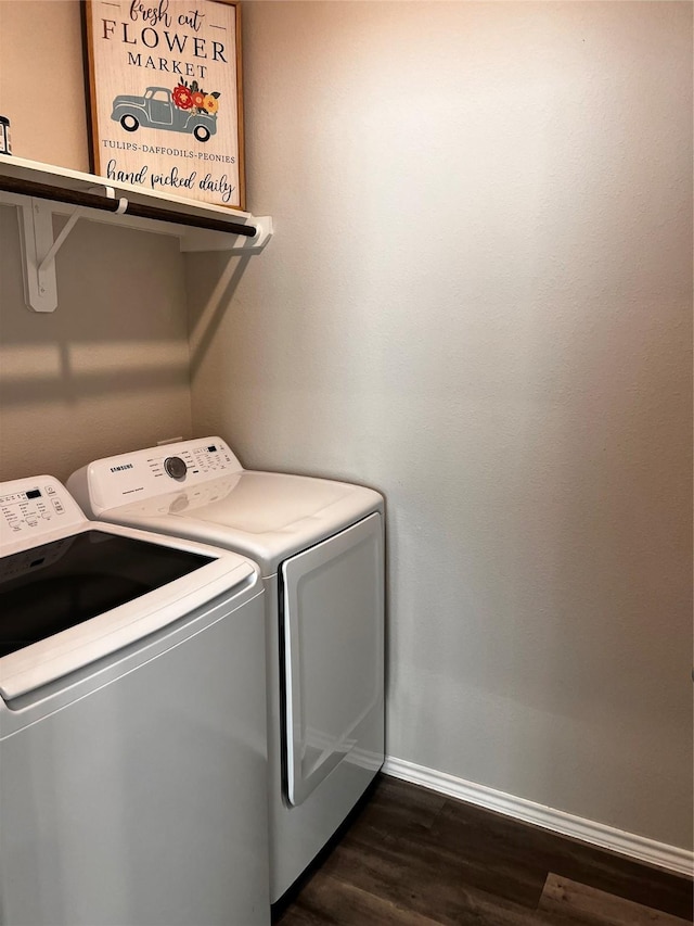 laundry area featuring dark hardwood / wood-style flooring and independent washer and dryer