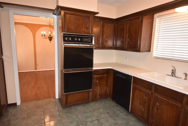 kitchen with black appliances, tile patterned flooring, sink, and a chandelier