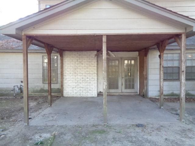 view of patio with french doors and a carport