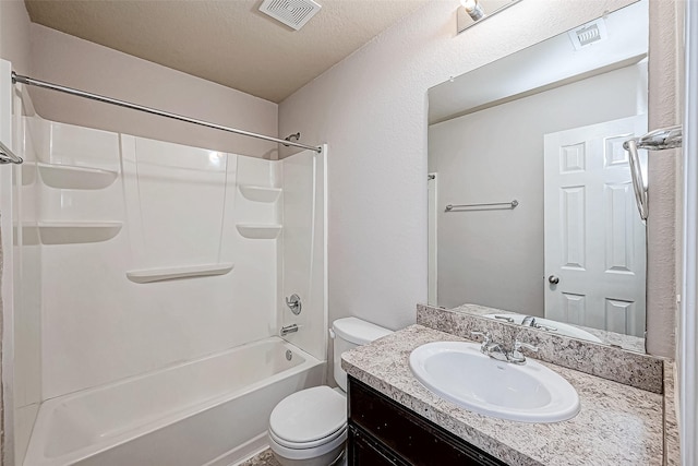 full bathroom with shower / bathing tub combination, vanity, toilet, and a textured ceiling