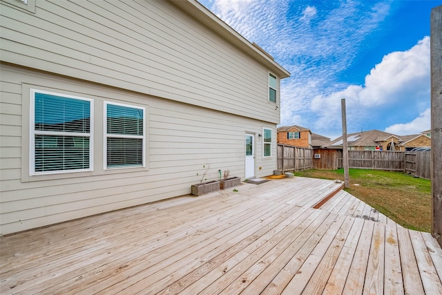 wooden deck featuring a yard