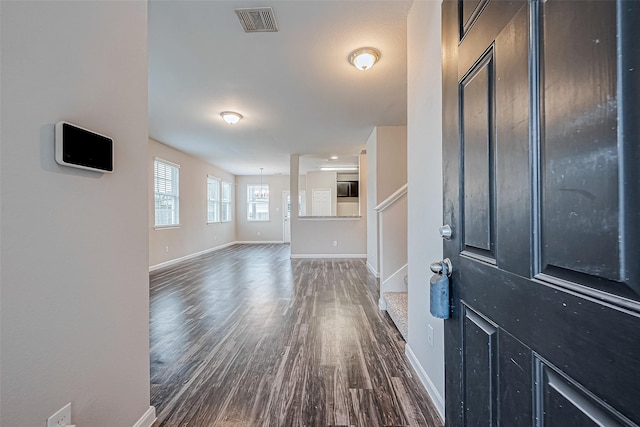 entrance foyer with dark hardwood / wood-style floors