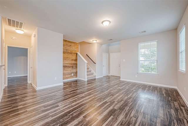 spare room with dark wood-type flooring