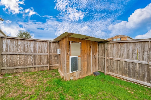 view of outbuilding with a yard