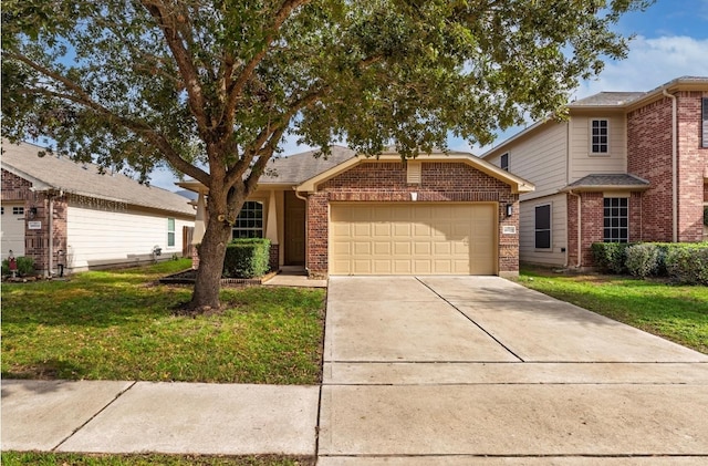 view of property featuring a garage and a front yard