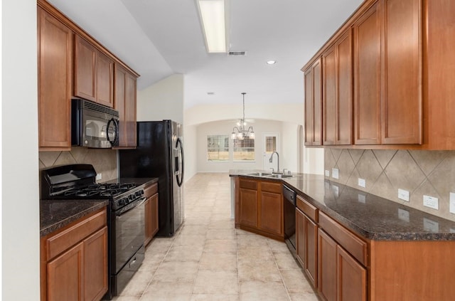 kitchen with pendant lighting, black appliances, sink, kitchen peninsula, and a chandelier