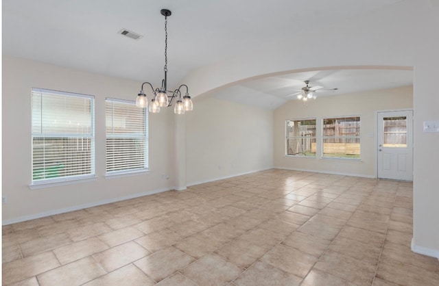 tiled spare room with ceiling fan with notable chandelier and lofted ceiling