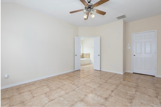 unfurnished bedroom featuring connected bathroom and ceiling fan