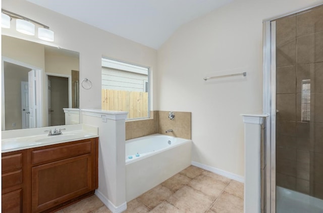 bathroom with tile patterned flooring, vanity, separate shower and tub, and lofted ceiling