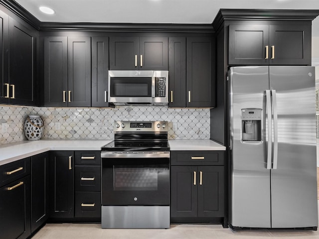 kitchen with decorative backsplash and appliances with stainless steel finishes