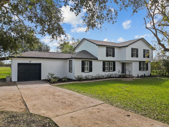 view of front property with a garage and a front lawn