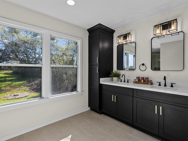 bathroom with tile patterned flooring and vanity