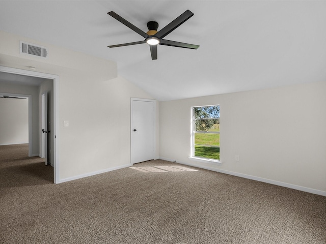 empty room featuring carpet, ceiling fan, and lofted ceiling