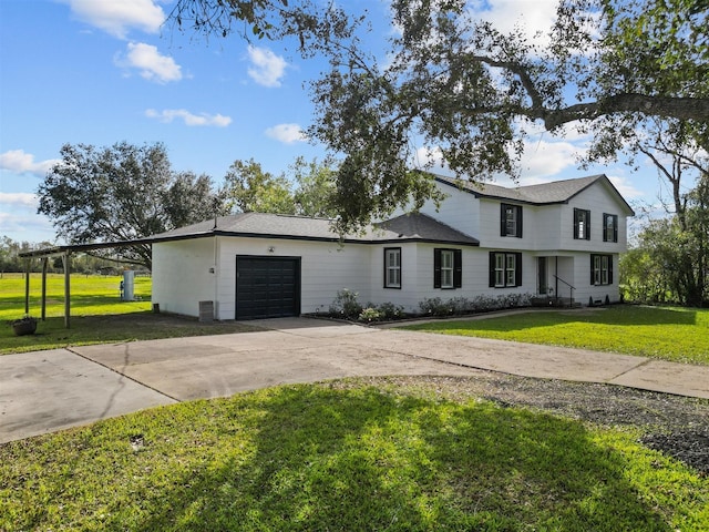 view of front of house featuring a garage and a front yard