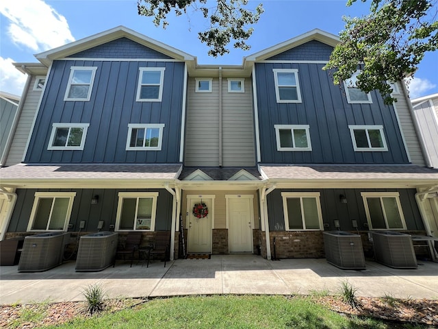 view of front of home featuring a patio area and central air condition unit