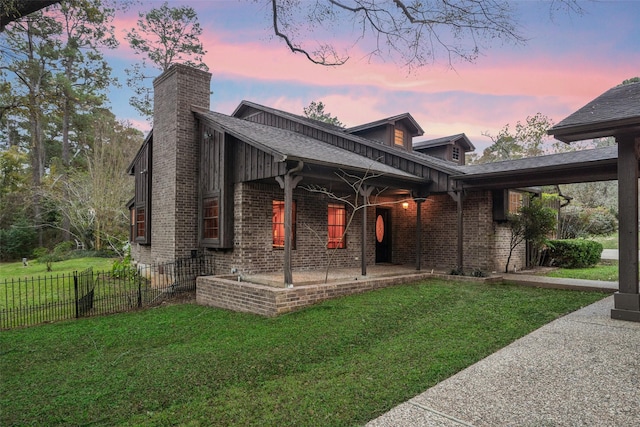 view of front of home with a yard