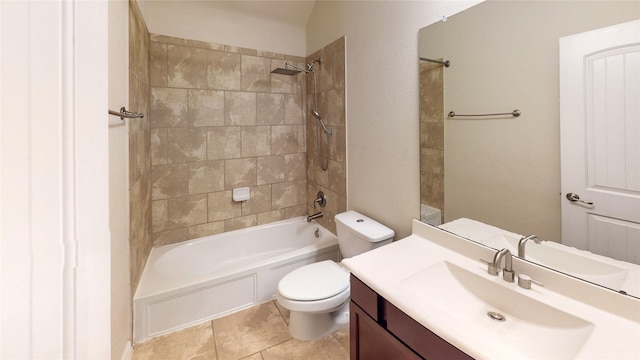 full bathroom with tile patterned flooring, vanity, toilet, and tiled shower / bath