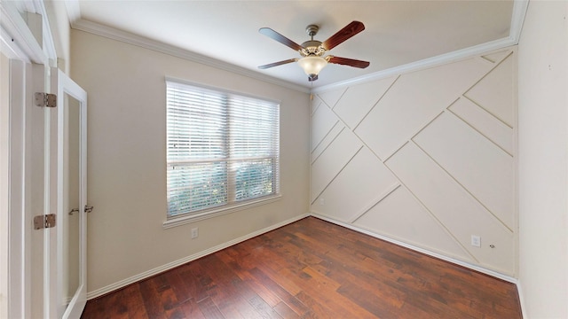 empty room featuring ceiling fan, dark wood-type flooring, and ornamental molding