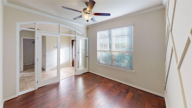 unfurnished bedroom with french doors, crown molding, ceiling fan, and dark wood-type flooring